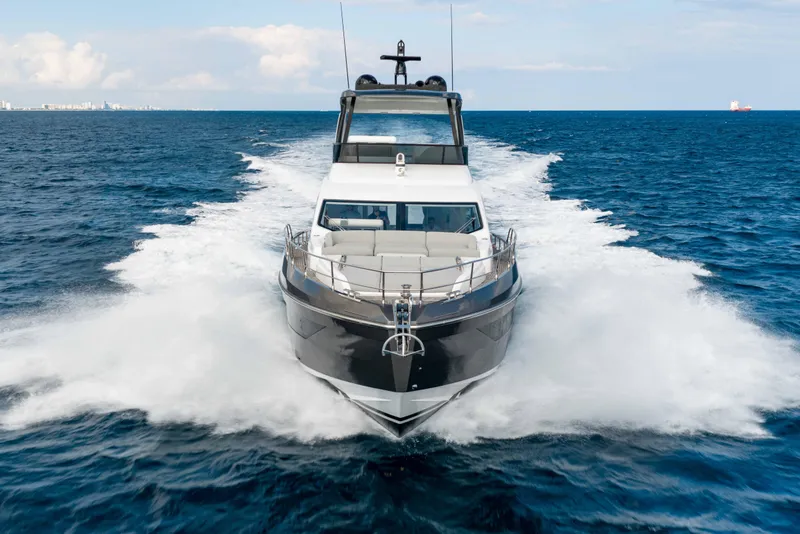 Slide: The Image of 2024 Azimut Fly 68 yacht cruising on open sea, creating a dynamic wake. - 3