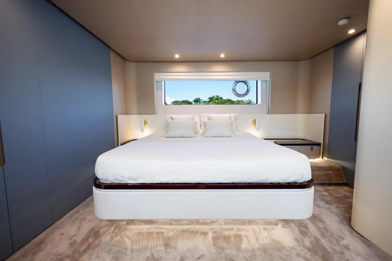 Slide: The Image of Luxurious bedroom interior of 2024 Azimut Fly 68 yacht with modern design and plush bedding. - 30
