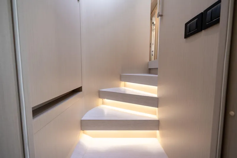 Slide: The Image of Staircase with ambient lighting in 2024 Azimut Fly 68 yacht interior. - 33