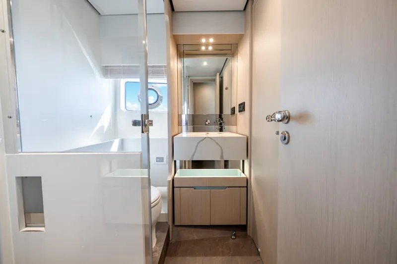 Slide: The Image of Luxurious bathroom interior of 2024 Azimut Fly 68 yacht, featuring modern fixtures and elegant design. - 38