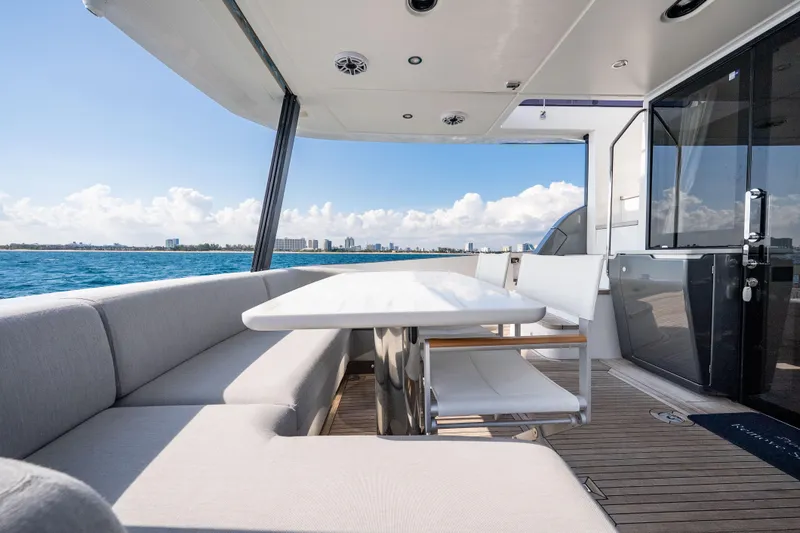 Slide: The Image of Luxurious 2024 Azimut Fly 68 yacht deck with elegant seating and ocean view. - 44