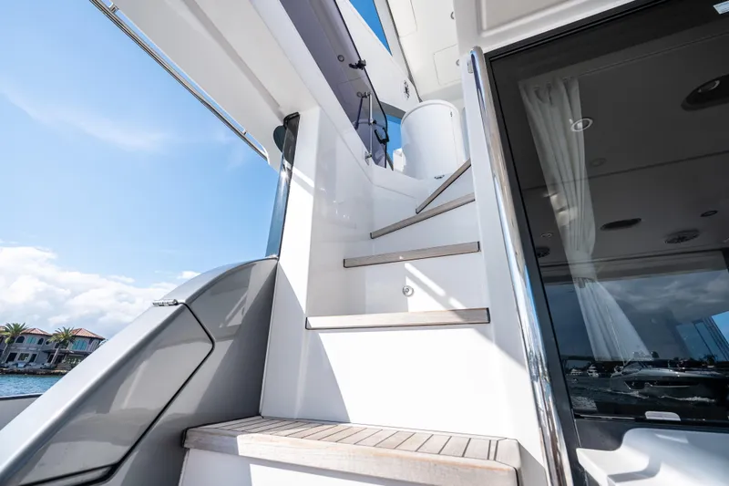 Slide: The Image of Staircase on 2024 Azimut Fly 68 yacht with modern design and ocean view. - 52