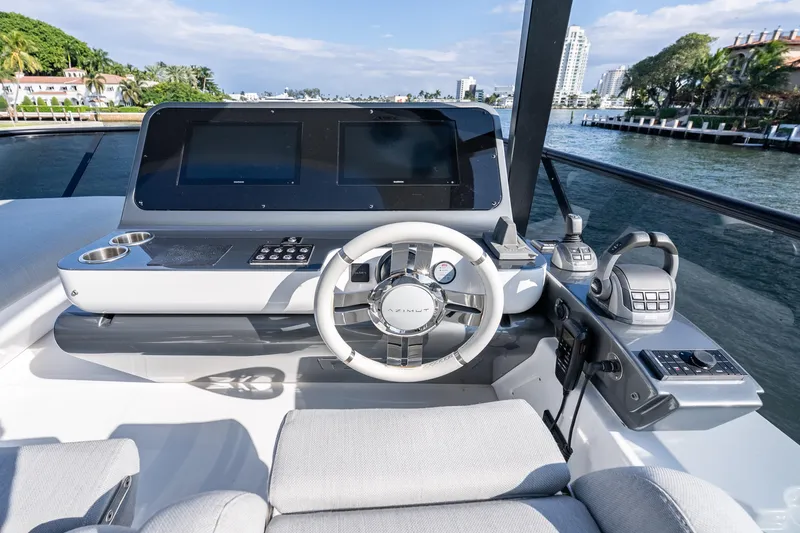 Slide: The Image of 2024 Azimut Fly 68 yacht helm with modern controls and dual screens. - 55