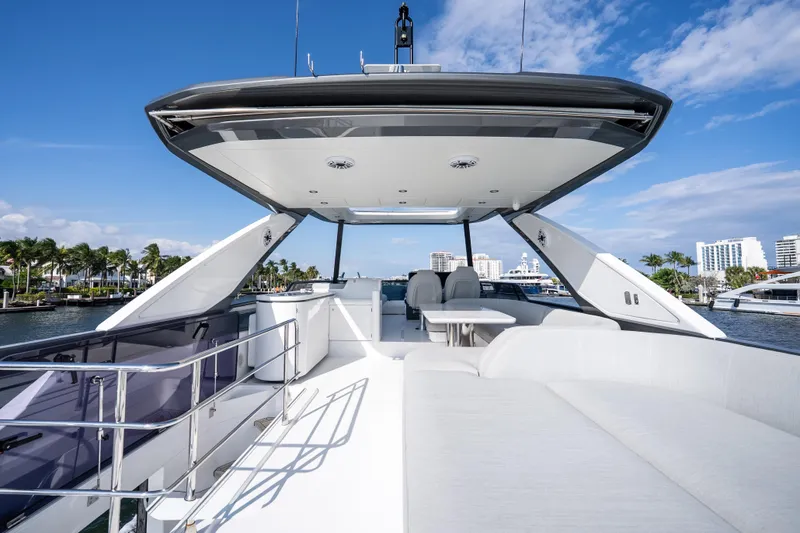 Slide: The Image of 2024 Azimut Fly 68 yacht deck with modern seating and ocean view. - 60