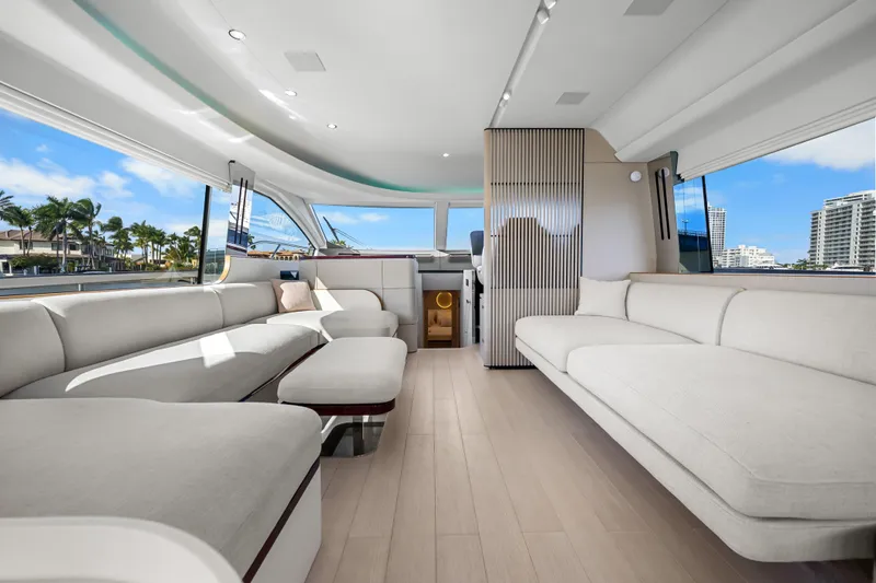 Slide: The Image of Luxurious interior of 2024 Azimut Fly 68 yacht with modern seating and panoramic windows. - 63