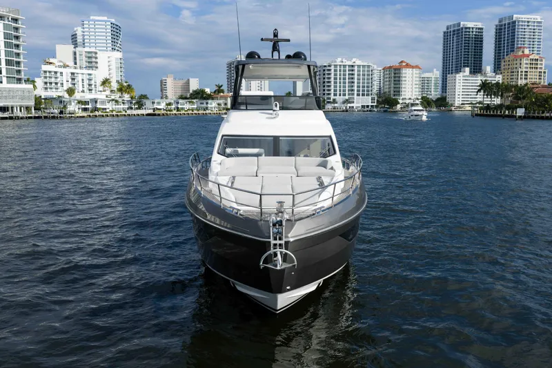 Slide: The Image of 2024 Azimut Fly 68 yacht on water with city skyline background. - 8