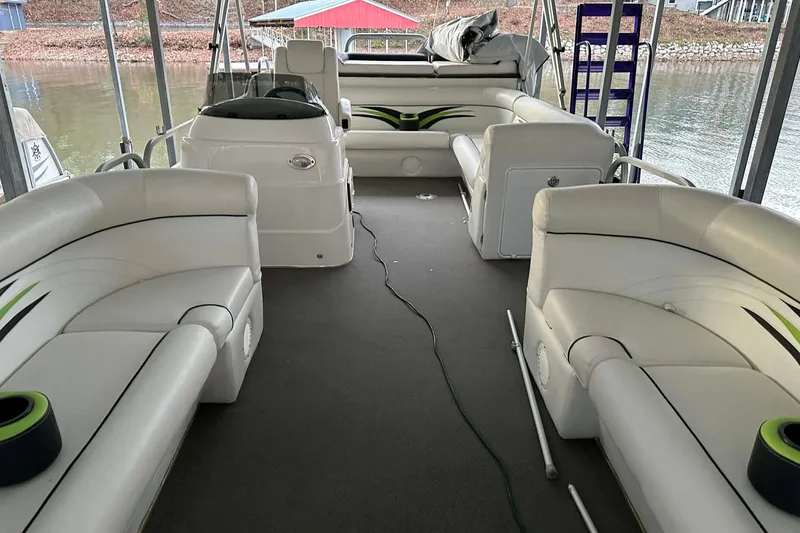Slide: The Image of Interior of a 2015 PlayCraft 25 Clipper pontoon boat with white seating. - 17