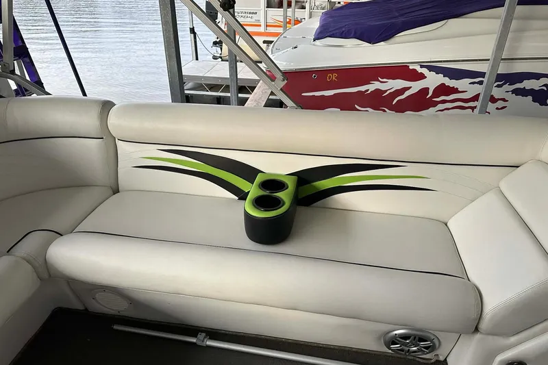 Slide: The Image of 2015 PlayCraft 25 Clipper boat interior with stylish seating and cup holders. - 18
