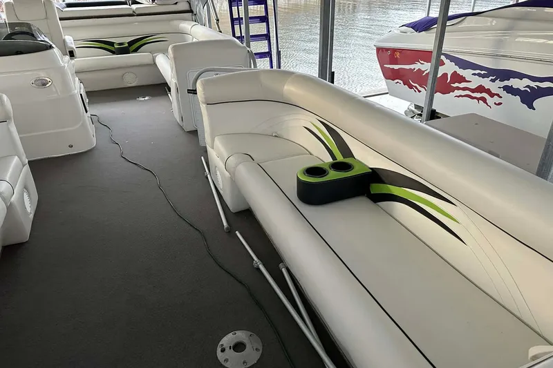 Slide: The Image of 2015 PlayCraft 25 Clipper boat interior with stylish seating and cup holders. - 5