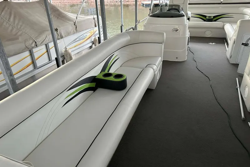 Slide: The Image of 2015 PlayCraft 25 Clipper boat interior with stylish seating and cup holders. - 6