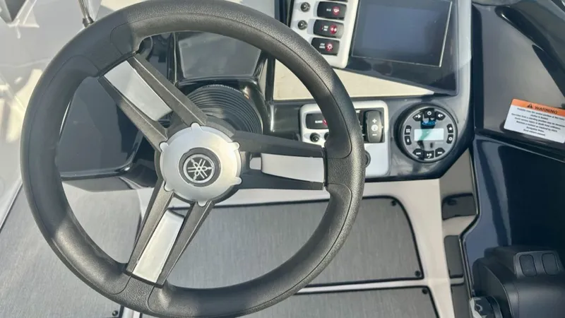 Slide: The Image of 2023 Yamaha SX 220 boat on trailer, side view. - 25