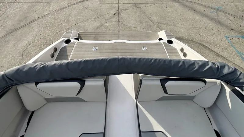 Slide: The Image of Interior of 2023 Yamaha Boats SX 220 with steering console and seat. - 27