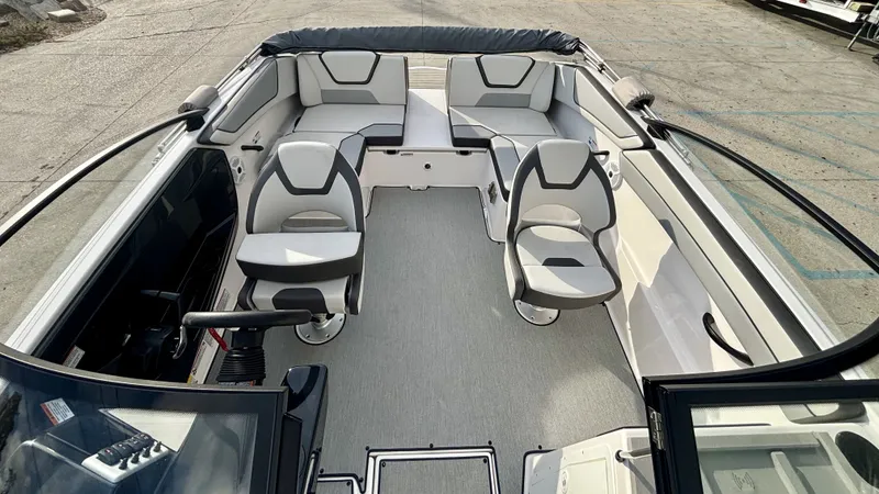 Slide: The Image of Interior view of 2023 Yamaha SX 220 boat with gray seating. - 3