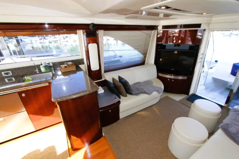 Slide: The Image of Luxurious interior of 2007 Sea Ray 580 Sedan Bridge yacht with modern furnishings. - 10