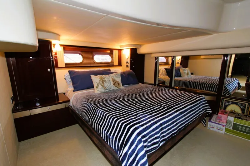 Slide: The Image of Luxurious bedroom interior of 2007 Sea Ray 580 Sedan Bridge yacht. - 11