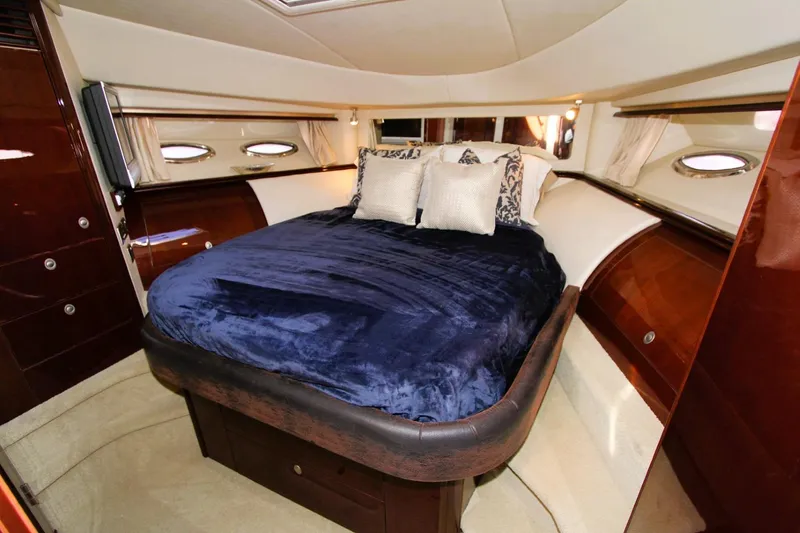 Slide: The Image of Luxurious bedroom interior of 2007 Sea Ray 580 Sedan Bridge yacht. - 24