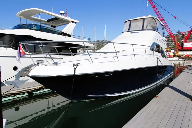 Slide: The Image of 2007 Sea Ray 580 Sedan Bridge yacht docked at marina. - 3