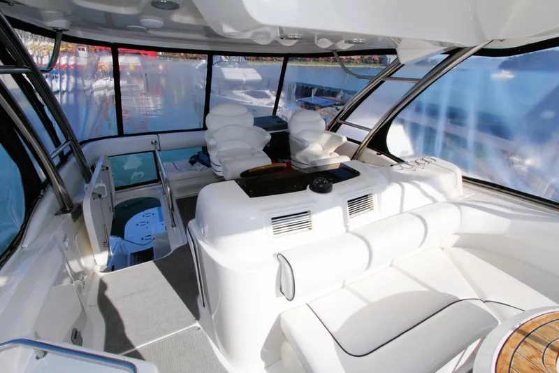 Slide: The Image of Luxurious interior of 2007 Sea Ray 580 Sedan Bridge yacht with white seating. - 30