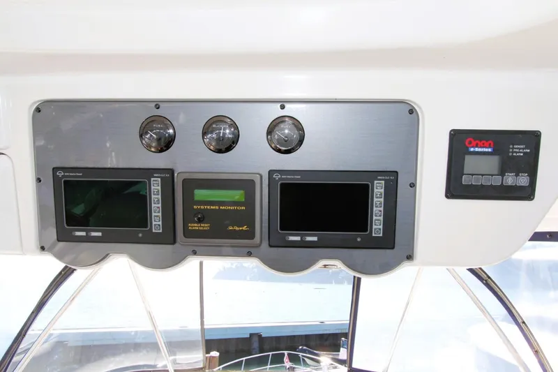 Slide: The Image of 2007 Sea Ray 580 Sedan Bridge dashboard with gauges and system monitors. - 33