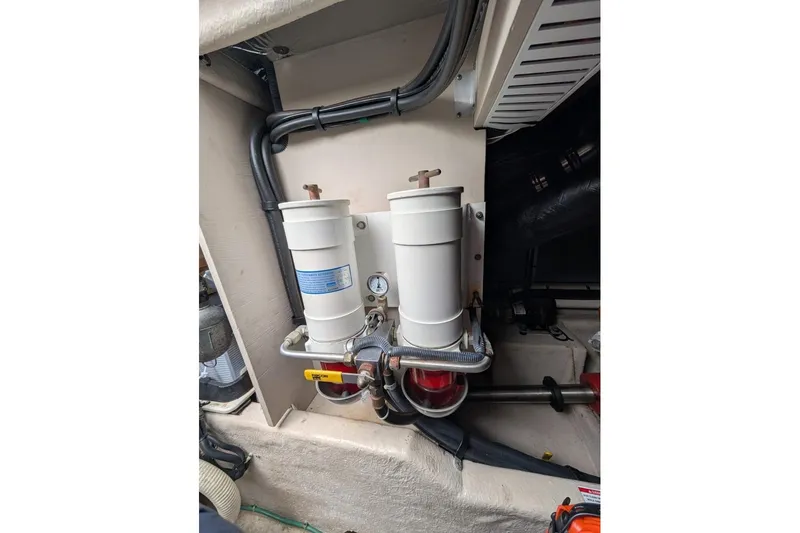 Slide: The Image of Engine room of 2007 Sea Ray 580 Sedan Bridge with dual fuel filters. - 37