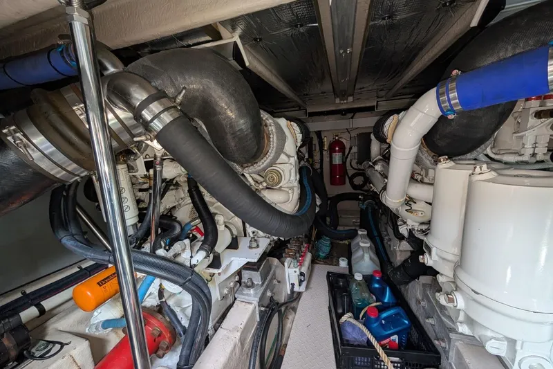 Slide: The Image of Engine room of 2007 Sea Ray 580 Sedan Bridge with visible machinery and equipment. - 40