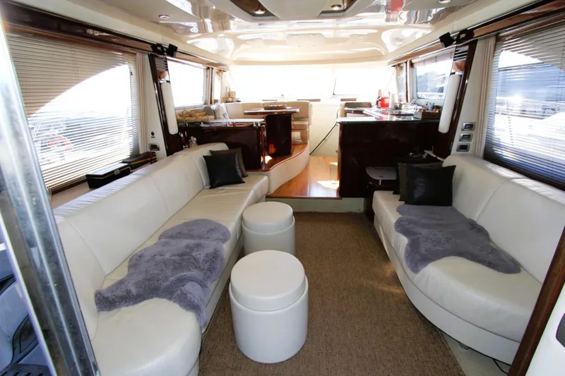 Slide: The Image of Luxurious interior of a 2007 Sea Ray 580 Sedan Bridge yacht with plush seating. - 5