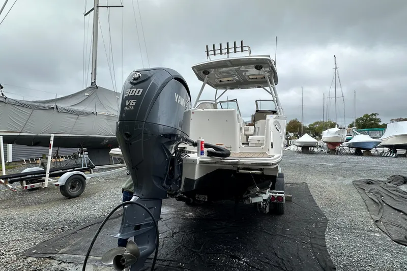 Slide: The Image of 2022 Cutwater C-24 DC boat with Yamaha 300 V6 engine in a boatyard. - 2