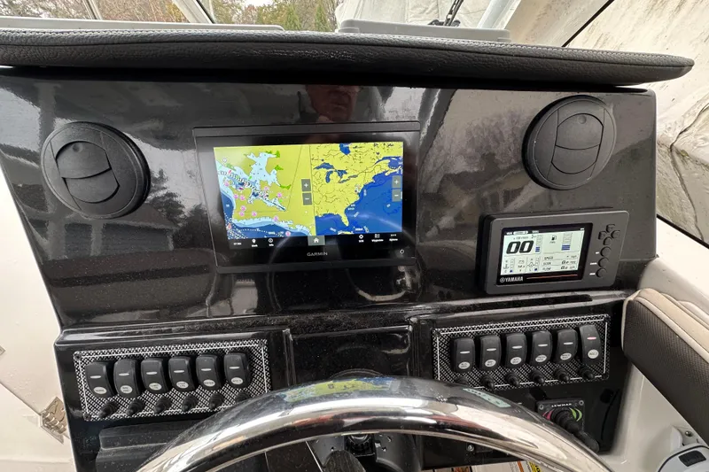 Slide: The Image of 2022 Cutwater C-24 DC dashboard with Garmin navigation and Yamaha display. - 4