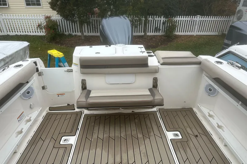 Slide: The Image of 2022 Cutwater C-24 DC boat interior with seating and teak flooring. - 8