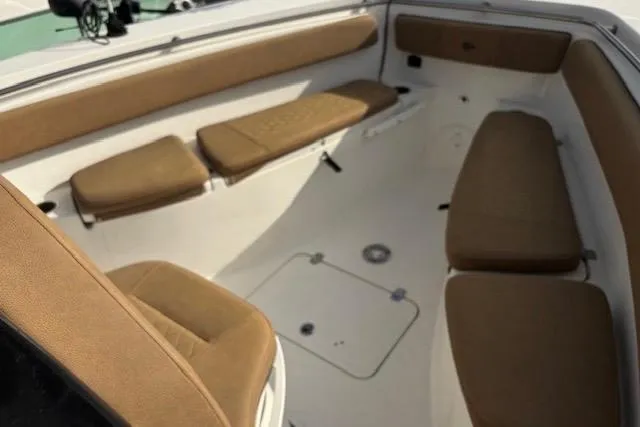 Slide: The Image of 2023 Sea Pro 259 Deep V CC boat interior with tan seating. - 11