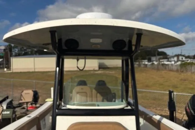 Slide: The Image of 2023 Sea Pro 259 Deep V CC boat with T-top and dual seats, parked outdoors. - 13