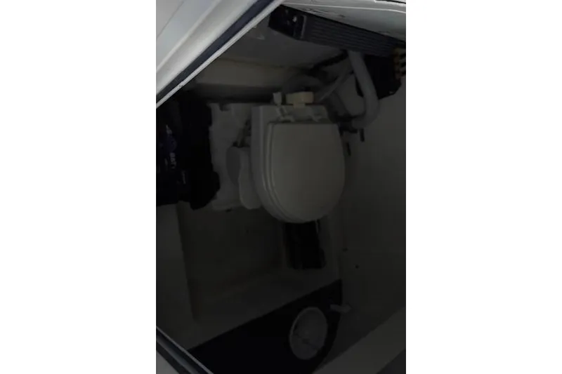 Slide: The Image of 2023 Sea Pro 259 Deep V CC boat interior with toilet. - 16