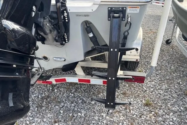 Slide: The Image of 2023 Sea Pro 259 Deep V CC boat trailer hitch and motor detail. - 5