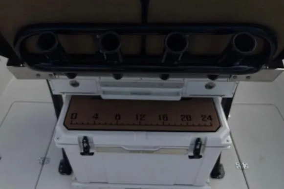 Slide: The Image of 2023 Sea Pro 259 Deep V CC boat with rod holders and cooler storage. - 7