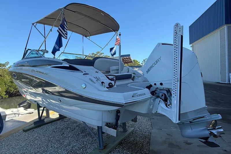 Slide: The Image of 2022 Crownline Eclipse E235 XS boat with Mercury engine on display. - 10