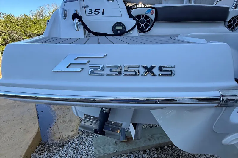Slide: The Image of 2022 Crownline Eclipse E235 XS boat rear view with model emblem. - 13