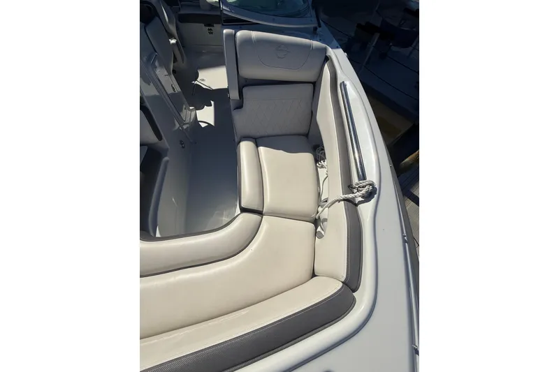 Slide: The Image of 2022 Crownline Eclipse E235 XS boat interior with plush seating. - 28
