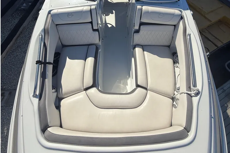 Slide: The Image of 2022 Crownline Eclipse E235 XS boat with spacious, cushioned seating area. - 29