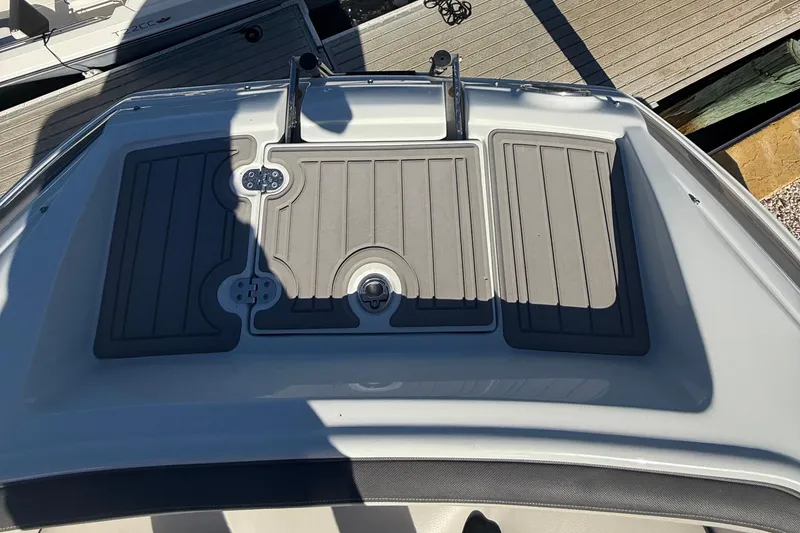 Slide: The Image of 2022 Crownline Eclipse E235 XS boat deck with gray non-slip surface. - 31