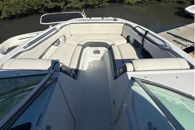 Slide: The Image of 2022 Crownline Eclipse E235 XS boat with spacious seating and sleek design. - 32