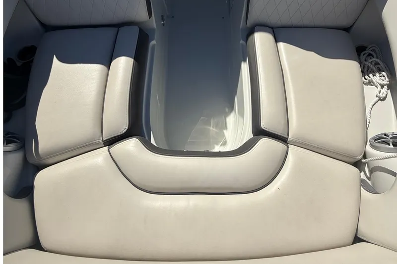 Slide: The Image of 2022 Crownline Eclipse E235 XS boat interior with beige cushioned seating. - 34