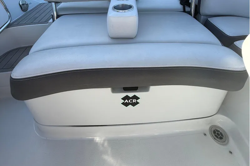 Slide: The Image of 2022 Crownline Eclipse E235 XS boat seat with cup holder and ACR logo. - 35