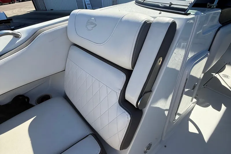 Slide: The Image of 2022 Crownline Eclipse E235 XS boat seat with white upholstery and diamond stitching. - 37