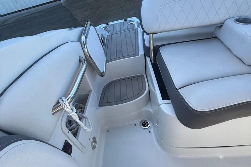 Slide: The Image of 2022 Crownline Eclipse E235 XS boat interior with seating and storage area. - 42