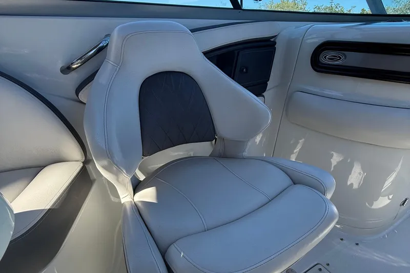 Slide: The Image of 2022 Crownline Eclipse E235 XS boat interior with plush seating and sleek design. - 45