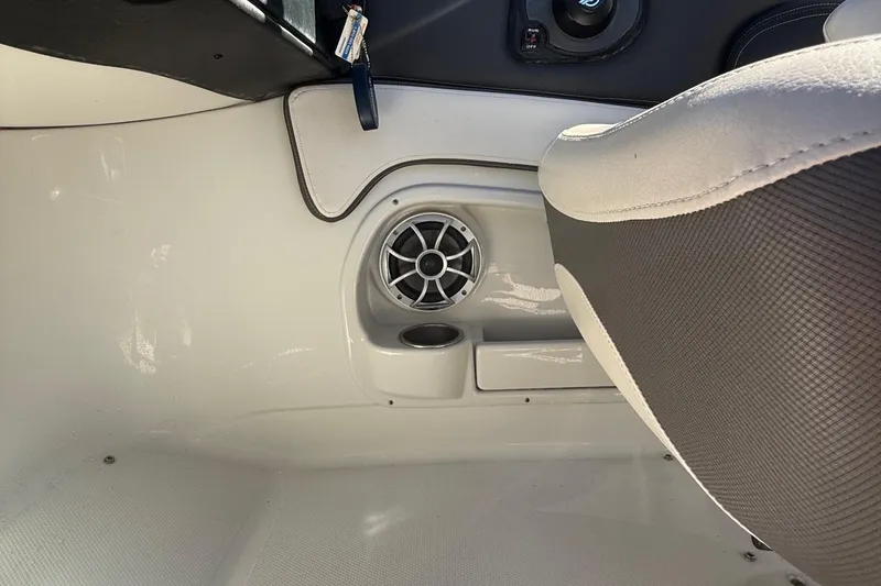 Slide: The Image of Interior of 2022 Crownline Eclipse E235 XS boat showing speaker and seating area. - 50