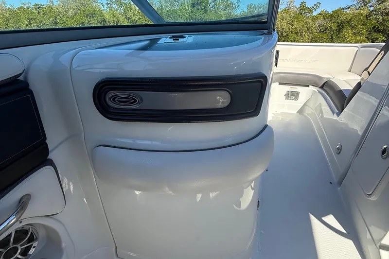 Slide: The Image of 2022 Crownline Eclipse E235 XS boat interior with sleek white design and modern features. - 51