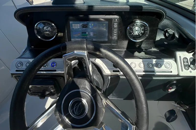 Slide: The Image of Steering wheel and dashboard of 2022 Crownline Eclipse E235 XS boat. - 52