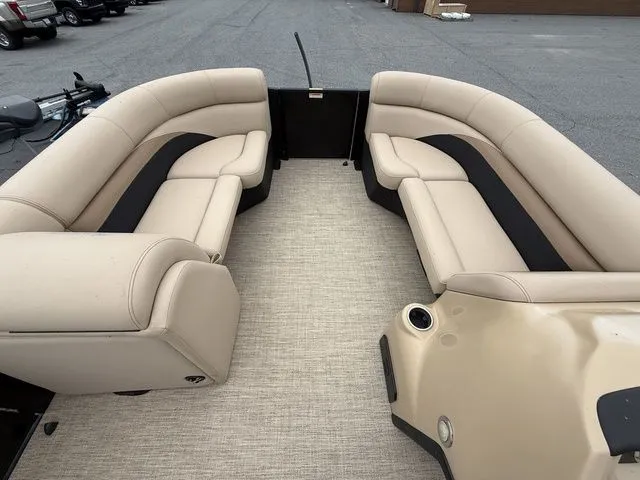 Slide: The Image of 2020 Barletta Boats C20Q pontoon interior with beige seating and spacious layout. - 11