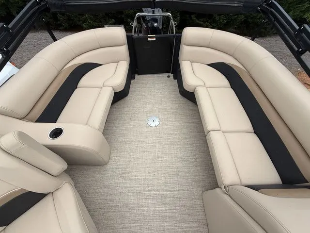 Slide: The Image of 2020 Barletta C20Q boat interior with beige seating and black accents. - 6